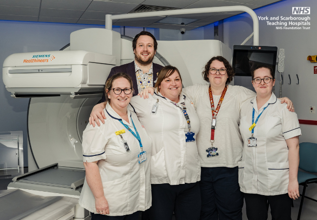 Staff from York Hospital stood together alongside the Nuclear Medicine department's new SPECT-CT scanner.