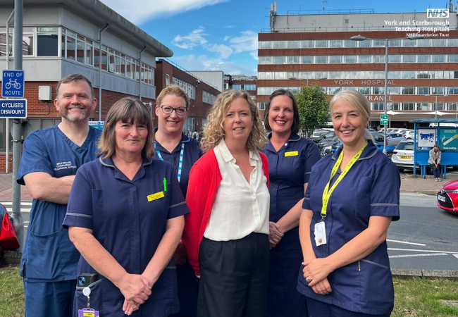 Healthcare professionals standing in front of York Hospital.